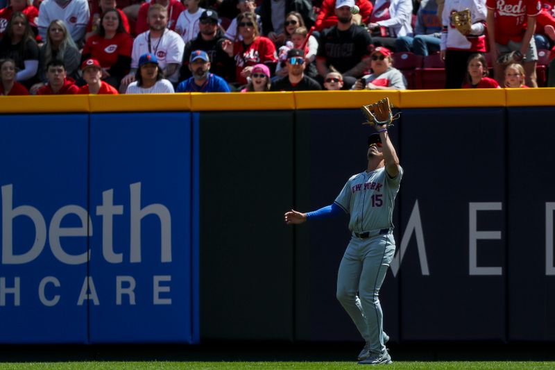 Apr 7, 2024; Cincinnati, Ohio, USA; New York Mets right fielder Tyrone Taylor (15) catches a pop up hit by Cincinnati Reds right fielder Stuart Fairchild (not pictured) in the second inning at Great American Ball Park. Mandatory Credit: Katie Stratman-USA TODAY Sports