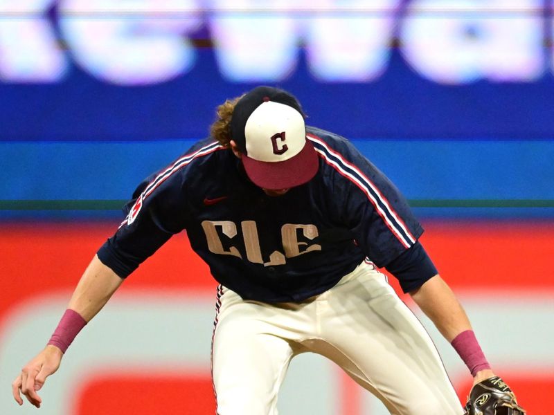 Sep 27, 2024; Cleveland, Ohio, USA; Cleveland Guardians shortstop Daniel Schneemann (10) makes an error on a ball hit by Houston Astros first baseman Victor Caratini (not pictured) during the first inning at Progressive Field. Mandatory Credit: Ken Blaze-Imagn Images