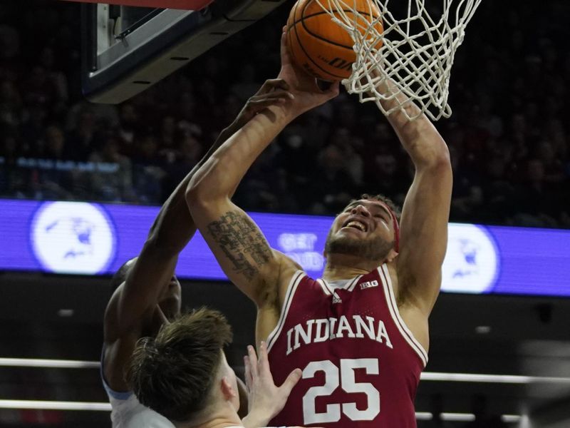 Feb 15, 2023; Evanston, Illinois, USA; Northwestern Wildcats guard Brooks Barnhizer (13) defends Indiana Hoosiers forward Race Thompson (25) during the first half at Welsh-Ryan Arena. Mandatory Credit: David Banks-USA TODAY Sports