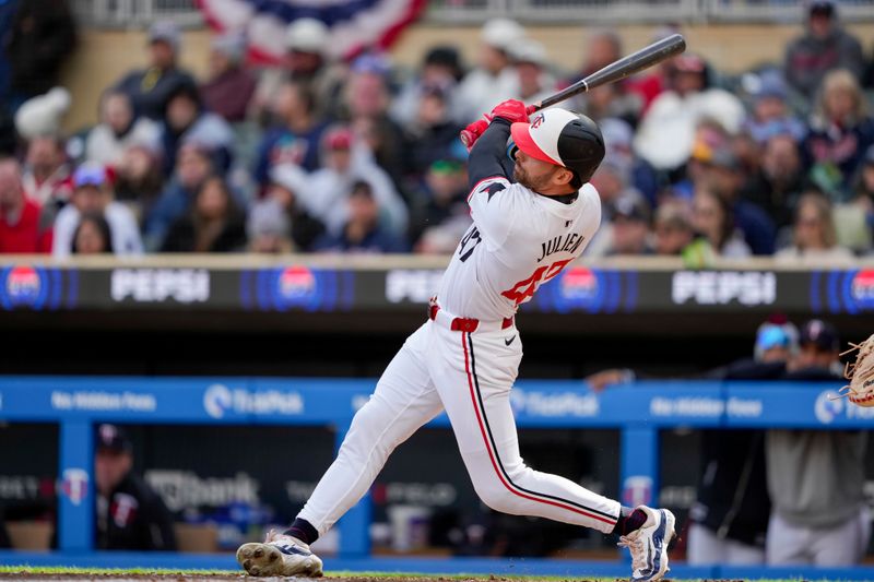 Apr 4, 2024; Minneapolis, Minnesota, USA; Minnesota Twins second baseman Edouard Julien (47) hits a solo home run during the fifth inning against the Cleveland Guardians at Target Field. Mandatory Credit: Jordan Johnson-USA TODAY Sports