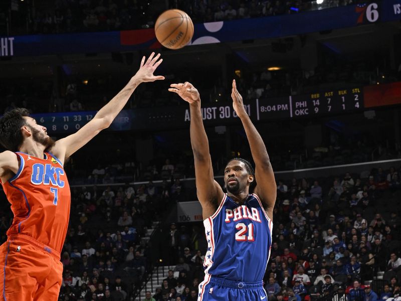 PHILADELPHIA, PA - APRIL 2: Joel Embiid #21 of the Philadelphia 76ers shoots a three point basket during the game against the Oklahoma City Thunder on April 2, 2024 at the Wells Fargo Center in Philadelphia, Pennsylvania NOTE TO USER: User expressly acknowledges and agrees that, by downloading and/or using this Photograph, user is consenting to the terms and conditions of the Getty Images License Agreement. Mandatory Copyright Notice: Copyright 2024 NBAE (Photo by David Dow/NBAE via Getty Images)