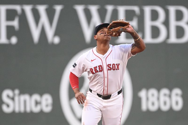 Aug 13, 2024; Boston, Massachusetts, USA; Boston Red Sox third baseman Rafael Devers (11) makes a catch for an out against the Texas Rangers at Fenway Park. Mandatory Credit: Eric Canha-USA TODAY Sports