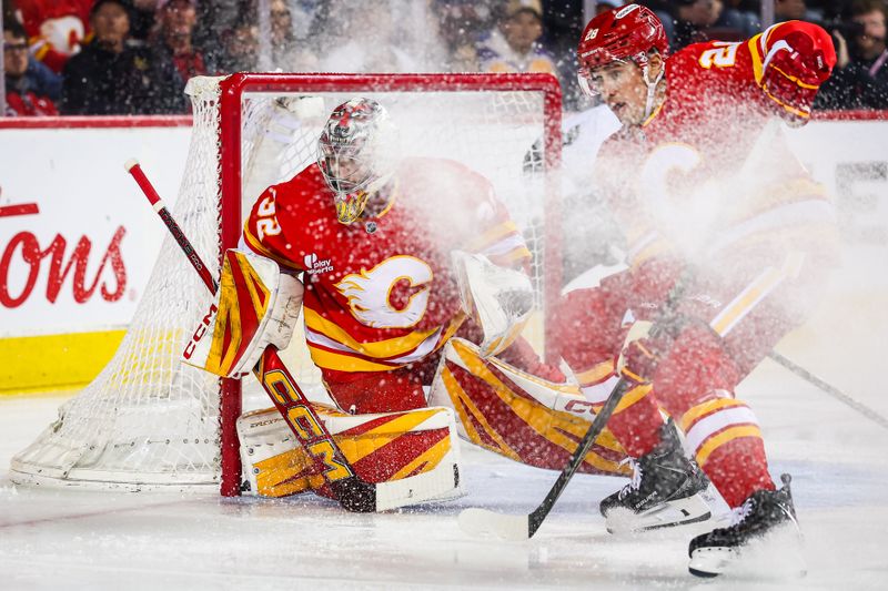 Mar 24, 2026; Calgary, Alberta, CAN; Calgary Flames goaltender Dustin Wolf (32) guards his net against the Los Angeles Kings during the first period at Scotiabank Saddledome. Mandatory Credit: Sergei Belski-Imagn Images