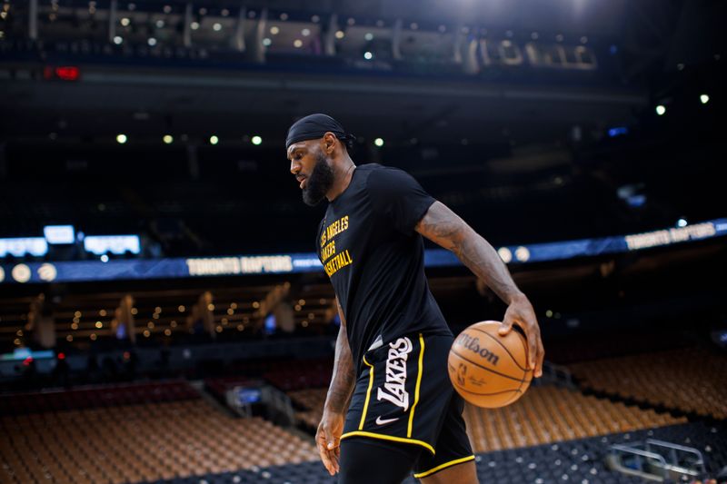 TORONTO, CANADA - APRIL 2: LeBron James #23 of the Los Angeles Lakers warms up ahead of their NBA game against the Toronto Raptors at Scotiabank Arena on April 2, 2024 in Toronto, Canada. NOTE TO USER: User expressly acknowledges and agrees that, by downloading and or using this photograph, User is consenting to the terms and conditions of the Getty Images License Agreement. (Photo by Cole Burston/Getty Images)