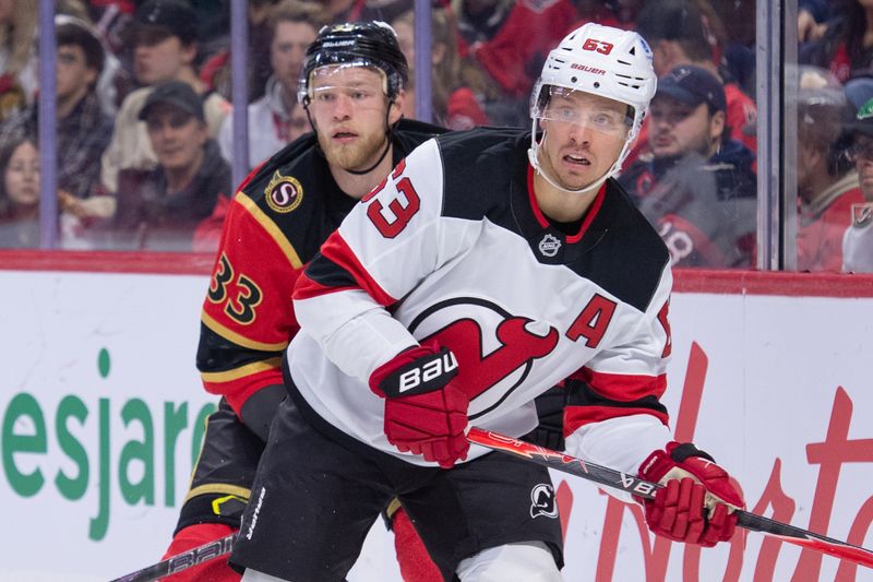 Dec 9, 2025; Ottawa, Ontario, CAN; Ottawa Senators defenseman Nikolas Martinpalo (33) battles with New Jersey Devils left wing Jesper Bratt (63) in the second period at the Canadian Tire Centre. Mandatory Credit: Marc DesRosiers-IMAGN Images