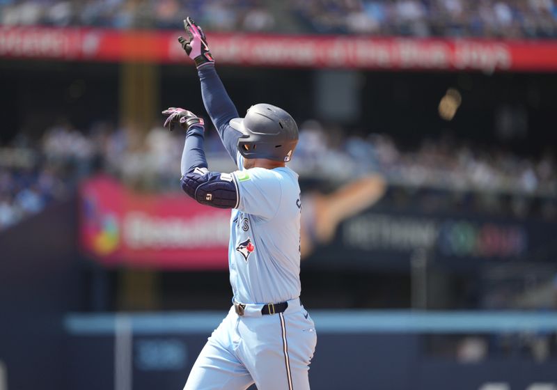 Aug 25, 2024; Toronto, Ontario, CAN; Toronto Blue Jays designated hitter George Springer (4) celebrates a single against the Los Angeles Angels during the fourth inning at Rogers Centre. Mandatory Credit: Nick Turchiaro-USA TODAY Sports