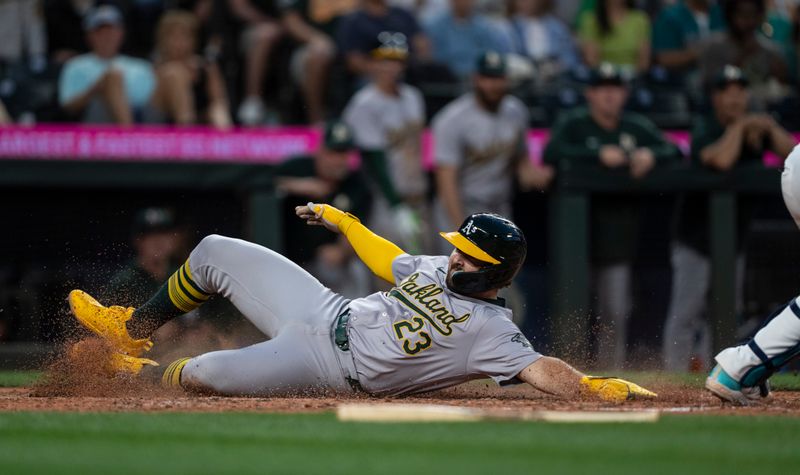 May 11, 2024; Seattle, Washington, USA; Oakland Athletics catcher Shea Langeliers (23) scores a run during the eighth inning against the Seattle Mariners at T-Mobile Park. Mandatory Credit: Stephen Brashear-USA TODAY Sports