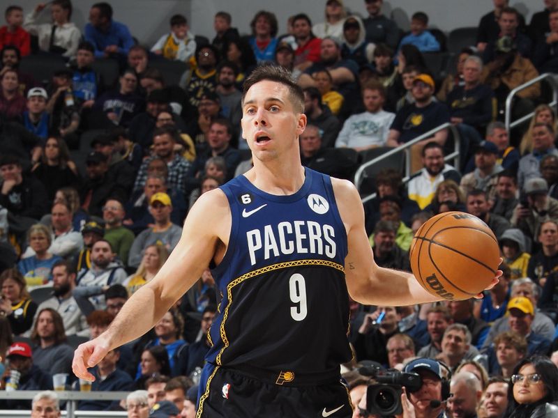 INDIANAPOLIS, IN - MARCH 27: T.J. McConnell #9 of the Indiana Pacers dribbles the ball during the game against the Dallas Mavericks on March 27, 2023 at Gainbridge Fieldhouse in Indianapolis, Indiana. NOTE TO USER: User expressly acknowledges and agrees that, by downloading and or using this Photograph, user is consenting to the terms and conditions of the Getty Images License Agreement. Mandatory Copyright Notice: Copyright 2023 NBAE (Photo by Ron Hoskins/NBAE via Getty Images)