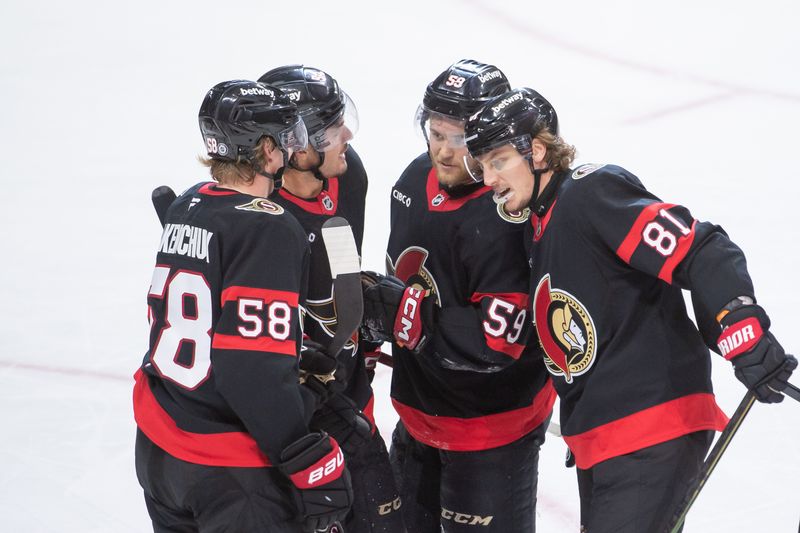 Sep 26, 2024; Ottawa, Ontario, CAN; Ottawa Senators right wing Adam Gaudette (81) celebrates with team his goal scored in the third period against the Buffalo Sabres at the Canadian Tire Centre. Mandatory Credit: Marc DesRosiers-Imagn Images