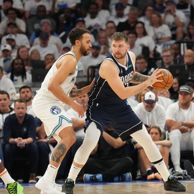 MINNEAPOLIS, MN - MAY 22: Luka Doncic #77 of the Dallas Mavericks looks to pass the ball during the game against the Minnesota Timberwolves during Game 1 of the Western Conference Finals of the 2024 NBA Playoffs on May 22, 2024 at Target Center in Minneapolis, Minnesota. NOTE TO USER: User expressly acknowledges and agrees that, by downloading and or using this Photograph, user is consenting to the terms and conditions of the Getty Images License Agreement. Mandatory Copyright Notice: Copyright 2024 NBAE (Photo by Jesse D. Garrabrant/NBAE via Getty Images)