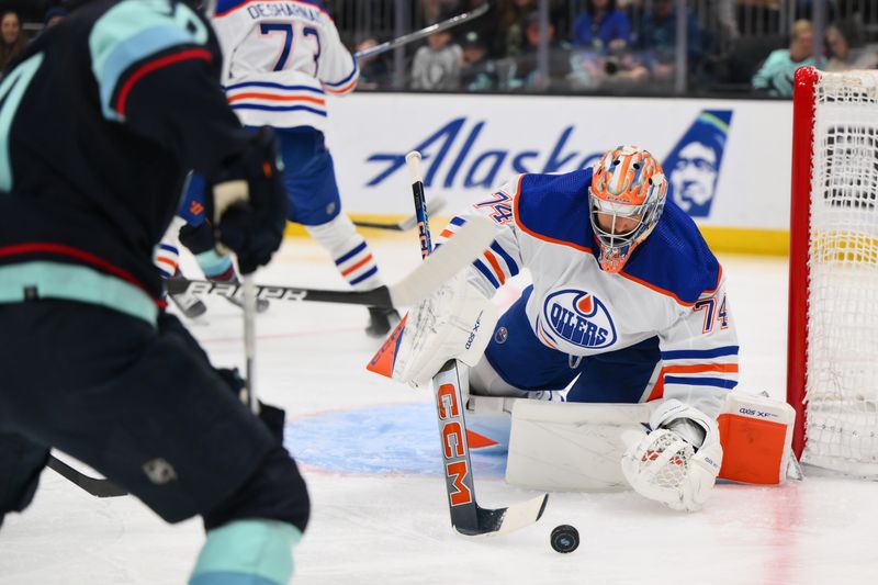 Mar 2, 2024; Seattle, Washington, USA; Edmonton Oilers goaltender Stuart Skinner (74) blocks a goal shot against the Seattle Kraken during the second period at Climate Pledge Arena. Mandatory Credit: Steven Bisig-USA TODAY Sports