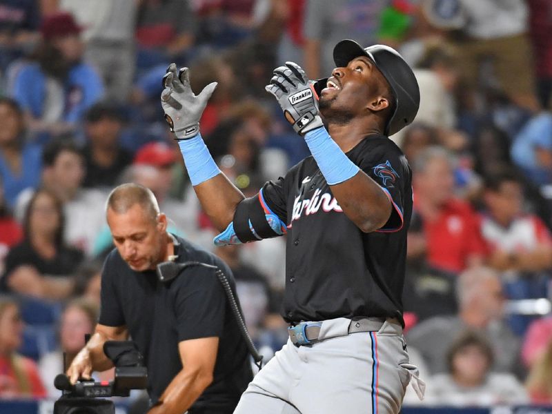 Aug 13, 2024; Philadelphia, Pennsylvania, USA; Miami Marlins outfielder Jesús Sánchez (12) celebrates his home run during the ninth inning against the Philadelphia Phillies at Citizens Bank Park. Mandatory Credit: Eric Hartline-USA TODAY Sports