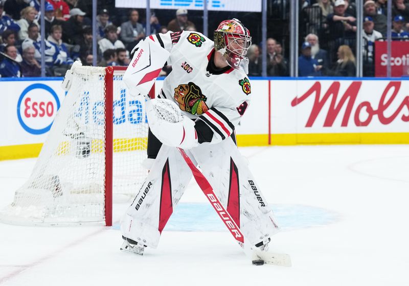 Dec 16, 2025; Toronto, Ontario, CAN; Chicago Blackhawks goaltender Spencer Knight (30) stick handles the puck against the Toronto Maple Leafs during the third period at Scotiabank Arena. Mandatory Credit: Nick Turchiaro-Imagn Images
