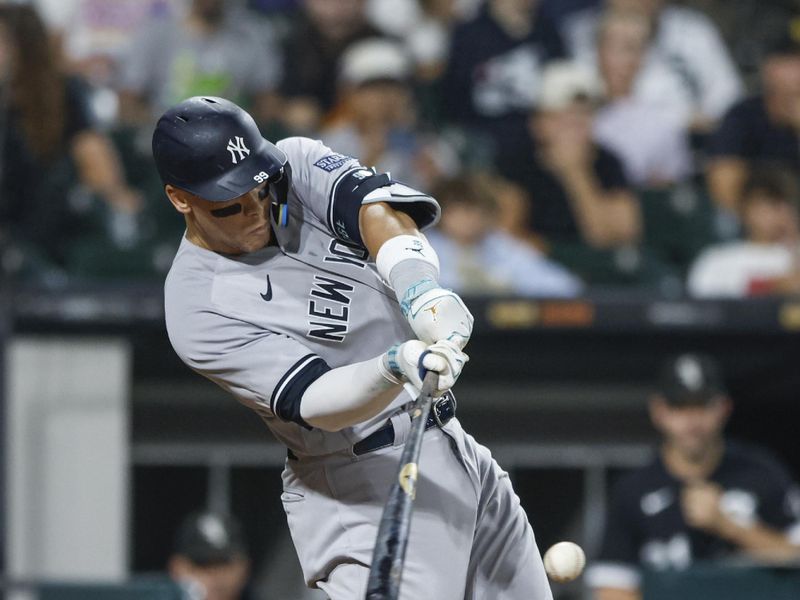 Aug 9, 2023; Chicago, Illinois, USA; New York Yankees right fielder Aaron Judge (99) singles against the Chicago White Sox during the eight inning at Guaranteed Rate Field. Mandatory Credit: Kamil Krzaczynski-USA TODAY Sports