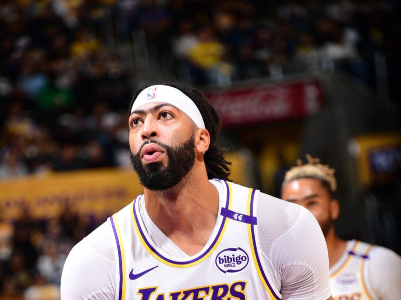 LOS ANGELES, CA - DECEMBER 8: Anthony Davis #3 of the Los Angeles Lakers shoots a free throw during the game against the Portland Trail Blazers on December 8, 2024 at Crypto.Com Arena in Los Angeles, California. NOTE TO USER: User expressly acknowledges and agrees that, by downloading and/or using this Photograph, user is consenting to the terms and conditions of the Getty Images License Agreement. Mandatory Copyright Notice: Copyright 2024 NBAE (Photo by Adam Pantozzi/NBAE via Getty Images)