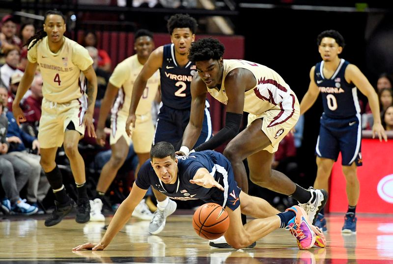 Jan 14, 2023; Tallahassee, Florida, USA; Virginia Cavaliers forward Kadin Shedrick (21) dives for a loose ball past Florida State Seminoles forward Naheem Mcleod (24) during the first half at Donald L. Tucker Center. Mandatory Credit: Melina Myers-USA TODAY Sports