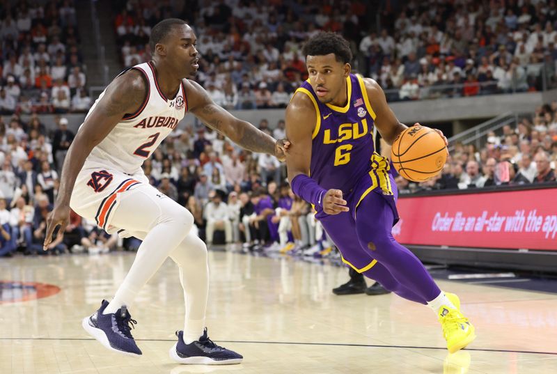 Jan 13, 2024; Auburn, Alabama, USA; LSU Tigers guard Jordan Wright (6) moves to the basket as Auburn Tigers forward Jaylin Williams (2) defends during the first half at Neville Arena. Mandatory Credit: John Reed-USA TODAY Sports