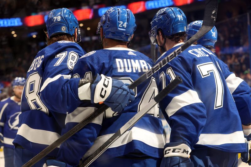 Apr 9, 2024; Tampa, Florida, USA; Tampa Bay Lightning center Anthony Cirelli (71) is congratulated after he scored a goal against the Columbus Blue Jackets during the third period at Amalie Arena. Mandatory Credit: Kim Klement Neitzel-USA TODAY Sports