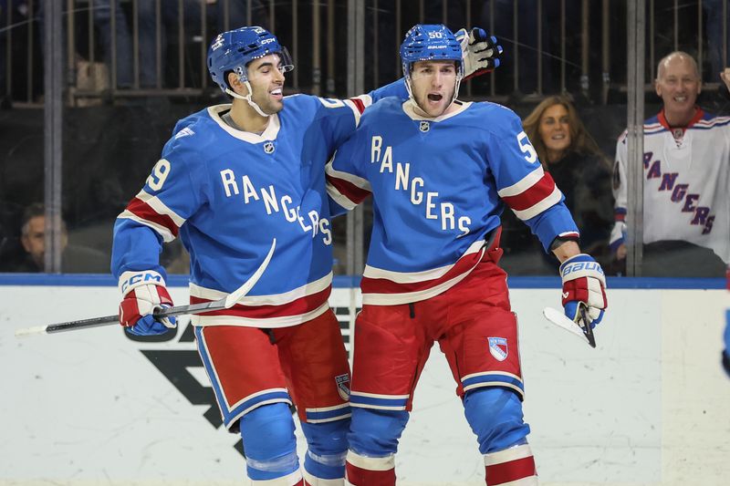 Dec 13, 2025; New York, New York, USA;  New York Rangers left wing Will Cuylle (50) celebrates with defenseman Matthew Robertson (29) after scoring a goal in the second period against the Montréal Canadiens at Madison Square Garden. Mandatory Credit: Wendell Cruz-Imagn Images