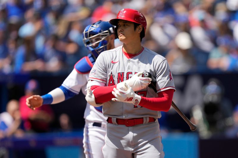 Jul 30, 2023; Toronto, Ontario, CAN; Los Angeles Angels designated hitter Shohei Ohtani (17) adjusts his batting gloves during an at bat against the Toronto Blue Jays during the first inning at Rogers Centre. Mandatory Credit: John E. Sokolowski-USA TODAY Sports