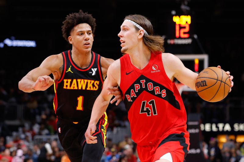 ATLANTA, GEORGIA - FEBRUARY 23: Kelly Olynyk #41 of the Toronto Raptors drives against Jalen Johnson #1 of the Atlanta Hawks during the fourth quarter at State Farm Arena on February 23, 2024 in Atlanta, Georgia. NOTE TO USER: User expressly acknowledges and agrees that, by downloading and or using this photograph, User is consenting to the terms and conditions of the Getty Images License Agreement. (Photo by Todd Kirkland/Getty Images)