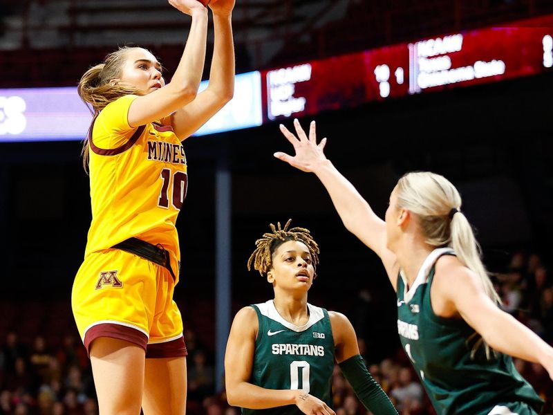 Jan 20, 2024; Minneapolis, Minnesota, USA; Minnesota Golden Gophers guard Mara Braun (10) shoots as Michigan State Spartans guard Tory Ozment (1) defends during the first half at Williams Arena. Mandatory Credit: Matt Krohn-USA TODAY Sports