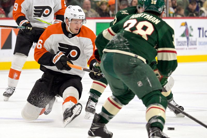 Jan 12, 2024; Saint Paul, Minnesota, USA; Philadelphia Flyers forward Joel Farabee (86) loses an edge as he carries the puck into the offensive zone against the Minnesota Wild during the first period at Xcel Energy Center. Mandatory Credit: Nick Wosika-USA TODAY Sports