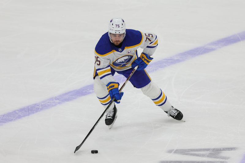 Feb 27, 2024; Sunrise, Florida, USA; Buffalo Sabres defenseman Connor Clifton (75) moves the puck against the Florida Panthers during the third period at Amerant Bank Arena. Mandatory Credit: Sam Navarro-USA TODAY Sports