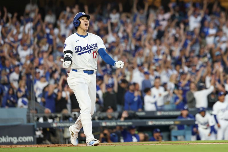 Oct 5, 2024; Los Angeles, California, USA; Los Angeles Dodgers designated hitter Shohei Ohtani (17) scores a home run against the San Diego Padres during game one of the NLDS for the 2024 MLB Playoffs at Dodger Stadium. Mandatory Credit: Kiyoshi Mio-Imagn Images