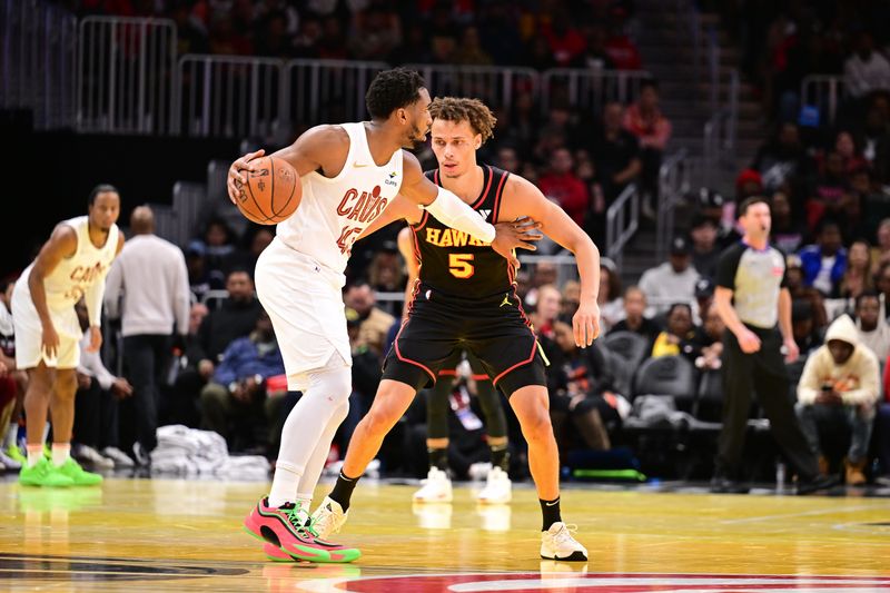 ATLANTA, GA - NOVEMBER 29: Dyson Daniels #5 of the Atlanta Hawks plays defense during the game against the Cleveland Cavaliers during the Emirates NBA Cup game on November 29, 2024 at State Farm Arena in Atlanta, Georgia.  NOTE TO USER: User expressly acknowledges and agrees that, by downloading and/or using this Photograph, user is consenting to the terms and conditions of the Getty Images License Agreement. Mandatory Copyright Notice: Copyright 2024 NBAE (Photo by Adam Hagy/NBAE via Getty Images)