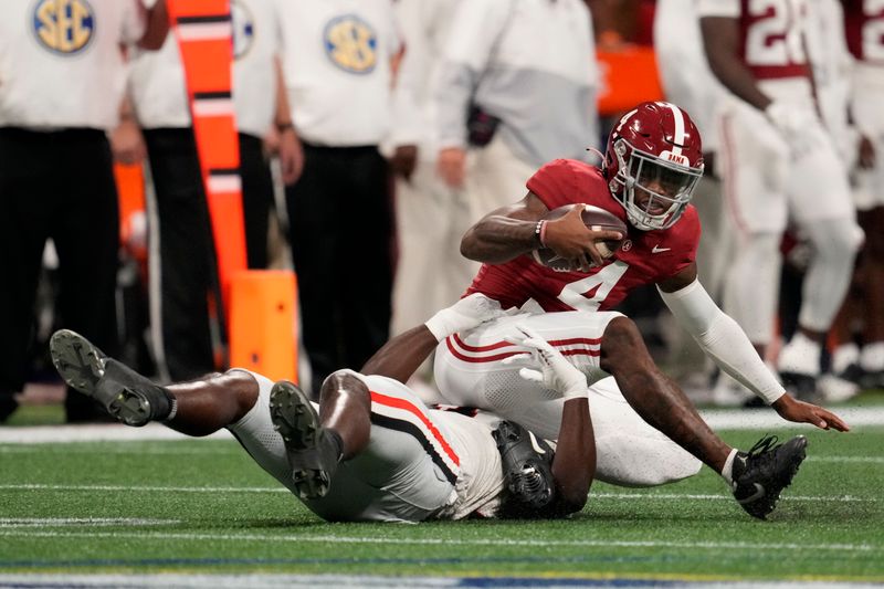 Dec 2, 2023; Atlanta, GA, USA; Georgia Bulldogs linebacker Jalon Walker (11) sacks Alabama Crimson Tide quarterback Jalen Milroe (4) during the first half in the SEC Championship game at Mercedes-Benz Stadium. Mandatory Credit: Dale Zanine-USA TODAY Sports