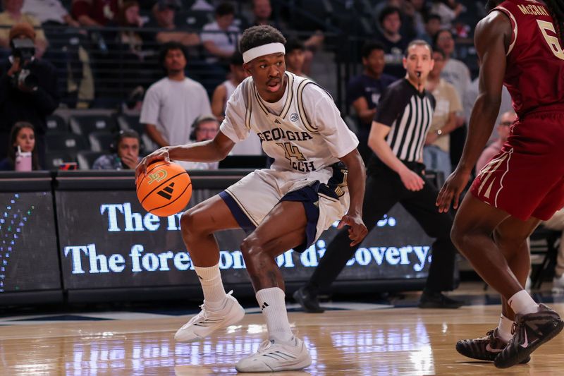 Feb 28, 2026; Atlanta, Georgia, USA; Georgia Tech Yellow Jackets forward Kowacie Reeves Jr. (14) dribbles against the Florida State Seminoles in the second half at McCamish Pavilion. Mandatory Credit: Brett Davis-Imagn Images