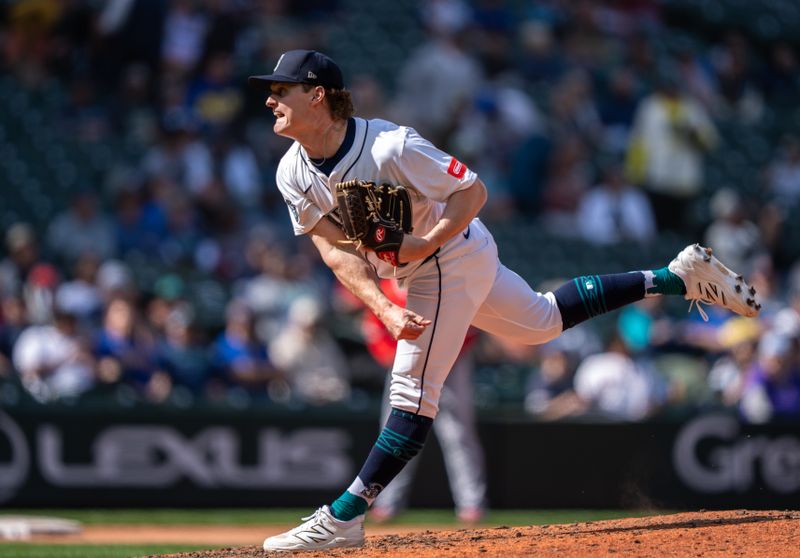 Apr 30, 2025; Seattle, Washington, USA;  Seattle Mariners reliever Troy Taylor (59)delivers a pitch during the ninth inning against the Los Angeles Angels at T-Mobile Park. Mandatory Credit: Stephen Brashear-Imagn Images