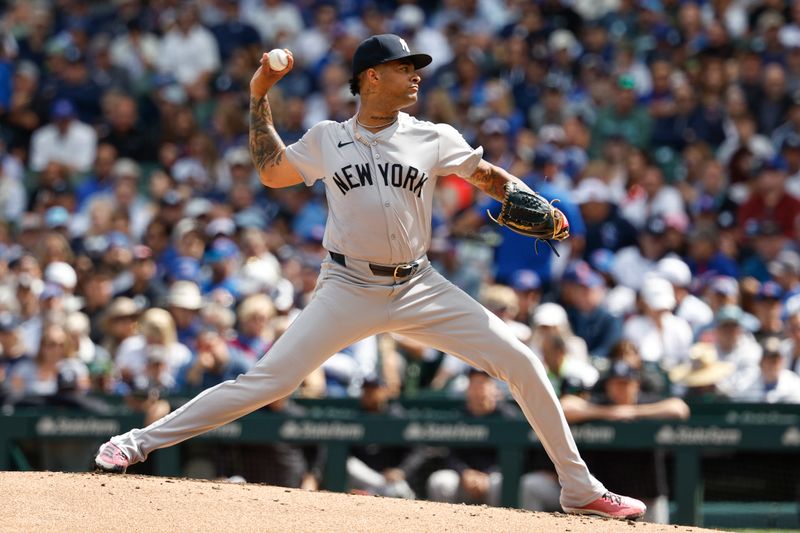 Sep 6, 2024; Chicago, Illinois, USA; New York Yankees starting pitcher Luis Gil (81) delivers a pitch against the Chicago Cubs during the first inning at Wrigley Field. Mandatory Credit: Kamil Krzaczynski-Imagn Images