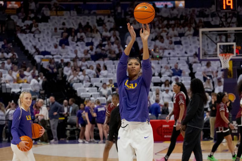 Jan 25, 2024; Baton Rouge, Louisiana, USA; LSU Lady Tigers forward Angel Reese warms up next to LSU Lady Tigers guard Hailey Van Lith, left, before a game against the South Carolina Gamecocks at Pete Maravich Assembly Center. Mandatory Credit: Matthew Hinton-USA TODAY Sports