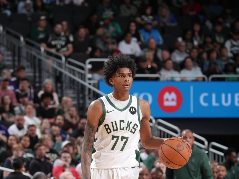 MILWAUKEE, WI - OCTOBER 10: AJ Johnson #77 of the Milwaukee Bucks dribbles the ball during the game against the Los Angeles Lakers during a preseason game on October 10, 2024 at Fiserv Forum Center in Milwaukee, Wisconsin. NOTE TO USER: User expressly acknowledges and agrees that, by downloading and or using this Photograph, user is consenting to the terms and conditions of the Getty Images License Agreement. Mandatory Copyright Notice: Copyright 2024 NBAE (Photo by Gary Dineen/NBAE via Getty Images).