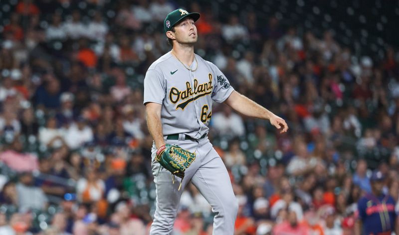 Sep 11, 2023; Houston, Texas, USA; Oakland Athletics relief pitcher Ken Waldichuk (64) looks up on a play during the seventh inning against the Houston Astros at Minute Maid Park. Mandatory Credit: Troy Taormina-USA TODAY Sports