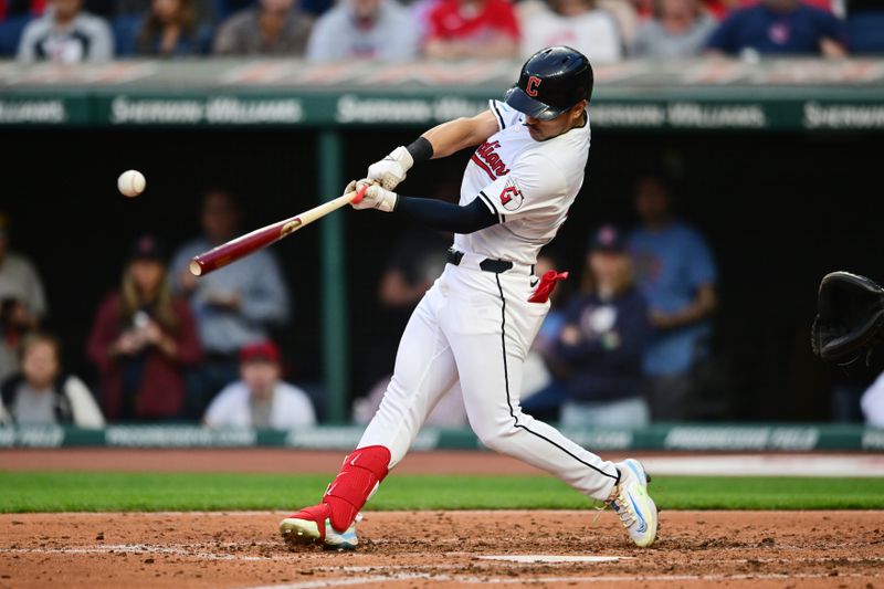 Apr 9, 2024; Cleveland, Ohio, USA; Cleveland Guardians left fielder Steven Kwan (38) hits an RBI single during the fourth inning against the Chicago White Sox at Progressive Field. Mandatory Credit: Ken Blaze-USA TODAY Sports