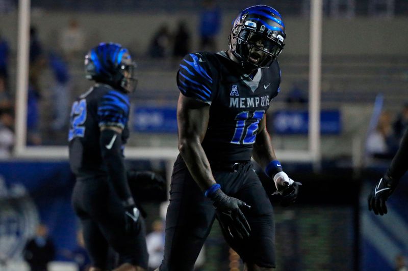 Nov 10, 2022; Memphis, Tennessee, USA; Memphis Tigers defensive linemen Cormontae Hamilton (12) reacts after a defensive stop during the second half against the Tulsa Golden Hurricane at Liberty Bowl Memorial Stadium. Mandatory Credit: Petre Thomas-USA TODAY Sports