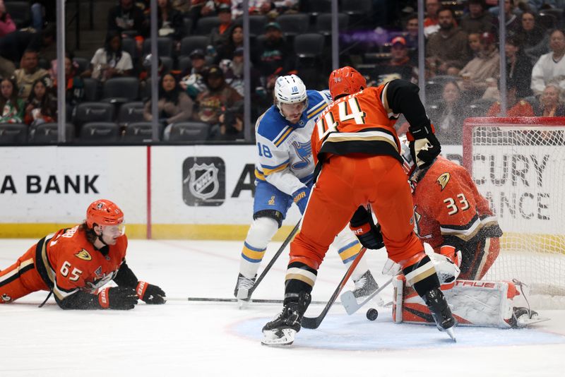 Mar 8, 2026; Anaheim, California, USA;  Anaheim Ducks goaltender Ville Husso (33) defends the goal against St. Louis Blues center Robert Thomas (18) during the first period at Honda Center. Mandatory Credit: Kiyoshi Mio-Imagn Images