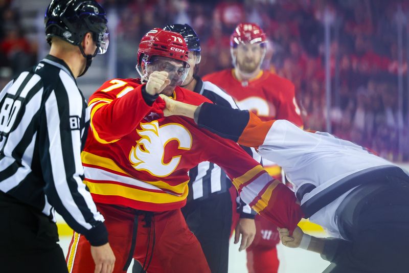 Oct 12, 2024; Calgary, Alberta, CAN; Calgary Flames center Martin Pospisil (76) and Philadelphia Flyers right wing Tyson Foerster (71) fights during the second period at Scotiabank Saddledome. Mandatory Credit: Sergei Belski-Imagn Images