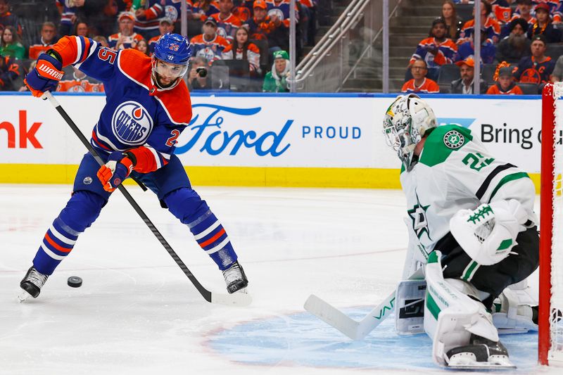 May 29, 2024; Edmonton, Alberta, CAN; Edmonton Oilers defensemen Darnell Nurse (25) tries to deflect a shot on Dallas Stars goaltender Jake Oettinger (29) during the third period in game four of the Western Conference Final of the 2024 Stanley Cup Playoffs at Rogers Place. Mandatory Credit: Perry Nelson-USA TODAY Sports