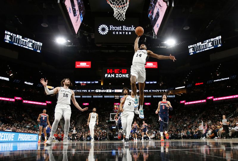 SAN ANTONIO, TX - JANUARY  29:  Blake Wesley #14 of the San Antonio Spurs dunks against the Washington Wizards  in the first half at Frost Bank Center on January 29, 2024 in San Antonio, Texas. NOTE TO USER: User expressly acknowledges and agrees that, by downloading and or using this photograph, User is consenting to terms and conditions of the Getty Images License Agreement. (Photo by Ronald Cortes/Getty Images)