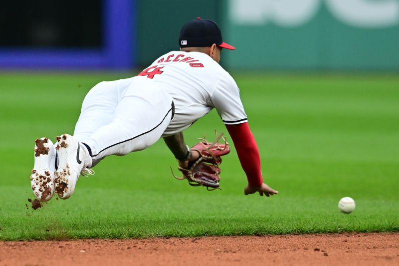 May 4, 2024; Cleveland, Ohio, USA; Cleveland Guardians shortstop Brayan Rocchio (4) dives for a hit by Los Angeles Angels third baseman Ehire Adrianza (not pictured) during the sixth inning at Progressive Field. Mandatory Credit: Ken Blaze-USA TODAY Sports