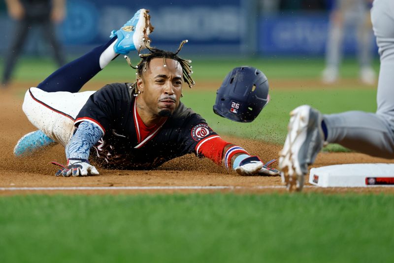 Jun 4, 2025; Washington, District of Columbia, USA; Washington Nationals shortstop Nasim Nuñez (26) steals third base against the Chicago Cubs during the eighth inning at Nationals Park. Mandatory Credit: Geoff Burke-Imagn Images