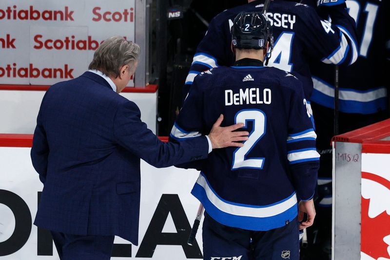 Apr 30, 2024; Winnipeg, Manitoba, CAN; Winnipeg Jets head coach Rick Bowness and Winnipeg Jets defenseman Dylan DeMelo (2) leave the ice after their defeat to the Colorado Avalanche in game five of the first round of the 2024 Stanley Cup Playoffs at Canada Life Centre. Mandatory Credit: James Carey Lauder-USA TODAY Sports