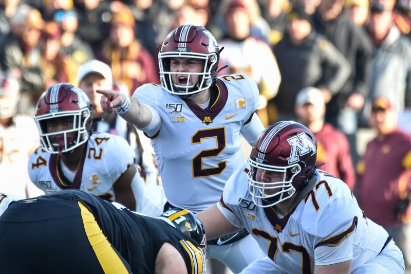 Nov 16, 2019; Iowa City, IA, USA; Minnesota Golden Gophers quarterback Tanner Morgan (2) directs the offense against the Iowa Hawkeyes during the first quarter at Kinnick Stadium. Mandatory Credit: Jeffrey Becker-USA TODAY Sports