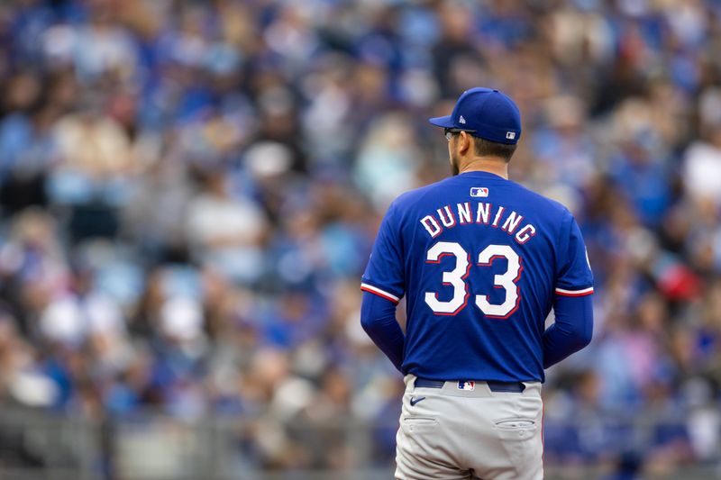 May 4, 2024; Kansas City, Missouri, USA; Texas Rangers pitcher Dane Dunning (33) on the mound during the first inning against the Kansas City Royals at Kauffman Stadium. Mandatory Credit: William Purnell-USA TODAY Sports