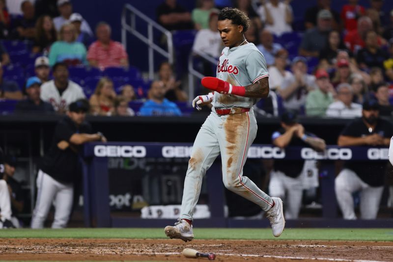 May 10, 2024; Miami, Florida, USA; Philadelphia Phillies left fielder Cristian Pache (19) scores against the Miami Marlins during the fourth inning at loanDepot Park. Mandatory Credit: Sam Navarro-USA TODAY Sports