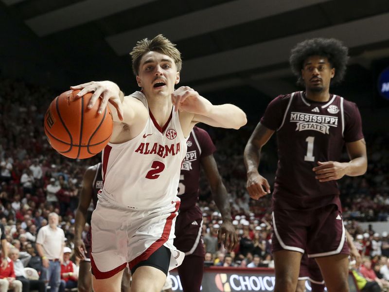 Feb 3, 2024; Tuscaloosa, Alabama, USA; Alabama forward Grant Nelson (2) reaches out to keep a rebound from going out of bounds as Mississippi State forward Tolu Smith III (1) closes on the play at Coleman Coliseum. Mandatory Credit: Gary Cosby Jr.-USA TODAY Sports